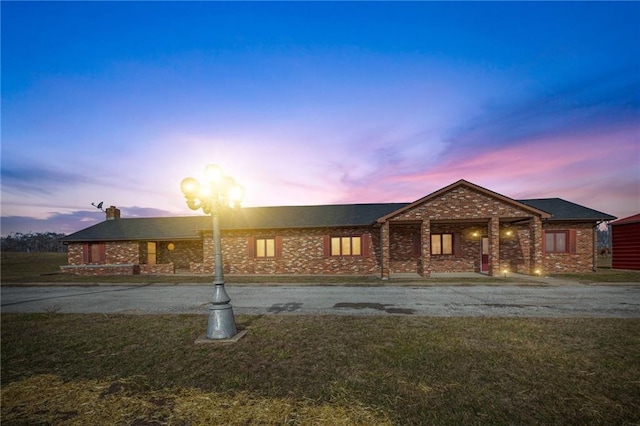 view of front of house with a yard