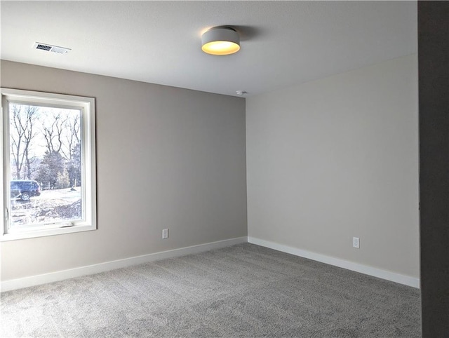 unfurnished room featuring carpet flooring