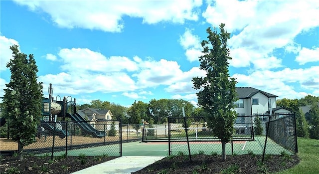 view of basketball court with a playground and tennis court