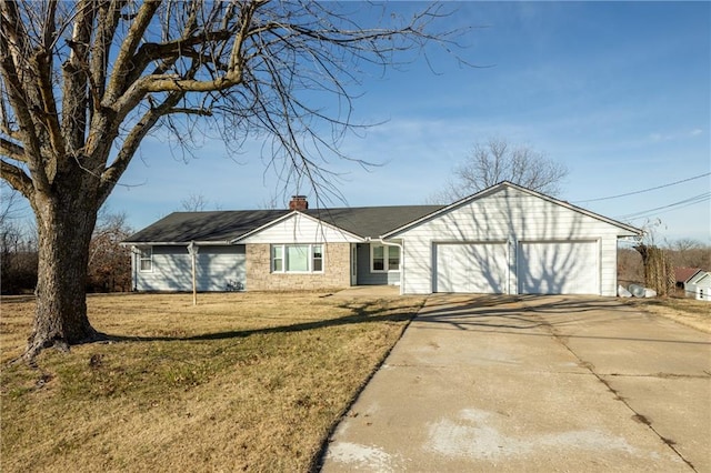 ranch-style home with a front yard and a garage