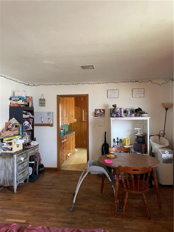 dining space with dark hardwood / wood-style floors