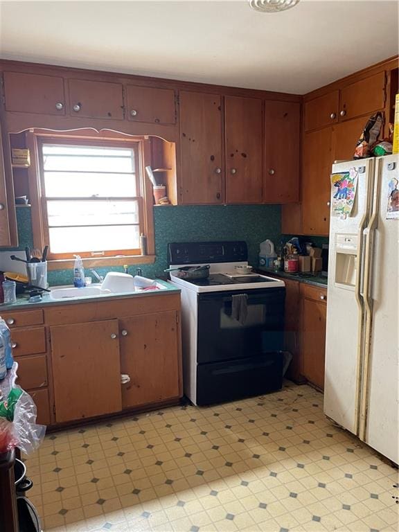 kitchen with white appliances and backsplash