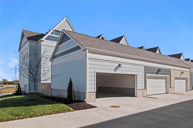 view of home's exterior featuring a garage and a yard