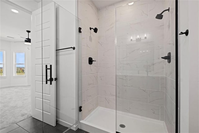 bathroom featuring an enclosed shower, tile patterned flooring, and ceiling fan