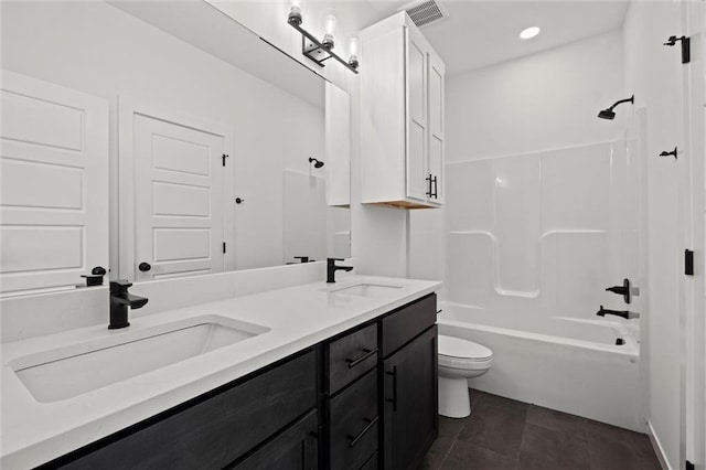 full bathroom featuring vanity, tile patterned floors, toilet, and shower / bath combination