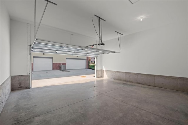 444 SW Brummel Rd, Lees Summit, MO 64081 - garage with a garage door opener and central AC