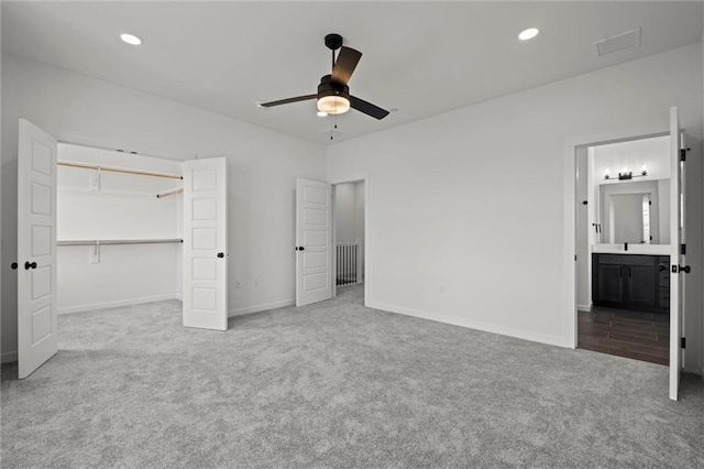 444 SW Brummel Rd, Lees Summit, MO 64081 - unfurnished bedroom with carpet floors, baseboards, recessed lighting, ensuite bath, and a closet
