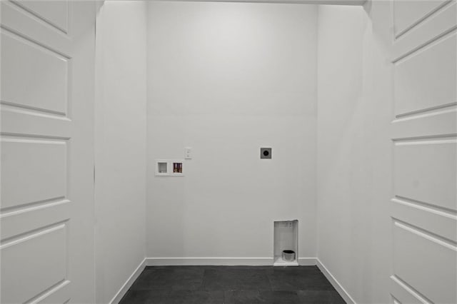 laundry area with electric dryer hookup, dark tile patterned floors, and washer hookup