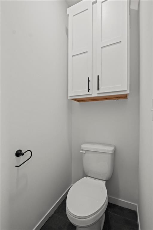 bathroom featuring tile patterned floors and toilet