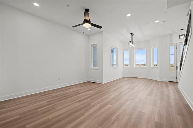 454 SW Brummel Rd, Lees Summit, MO 64081 - empty room with recessed lighting, light wood finished floors, a ceiling fan, baseboards, and a chandelier