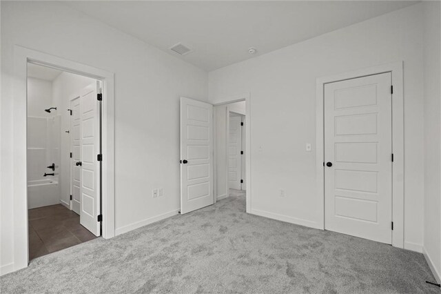 458 SW Brummel Rd, Lees Summit, MO 64081 - unfurnished bedroom with carpet flooring, baseboards, and connected bathroom