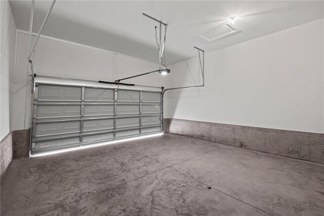 458 SW Brummel Rd, Lees Summit, MO 64081 - garage featuring a garage door opener