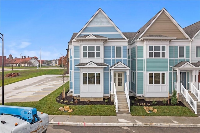 458 SW Brummel Rd, Lees Summit, MO 64081 - view of front facade with entry steps, a residential view, and roof with shingles
