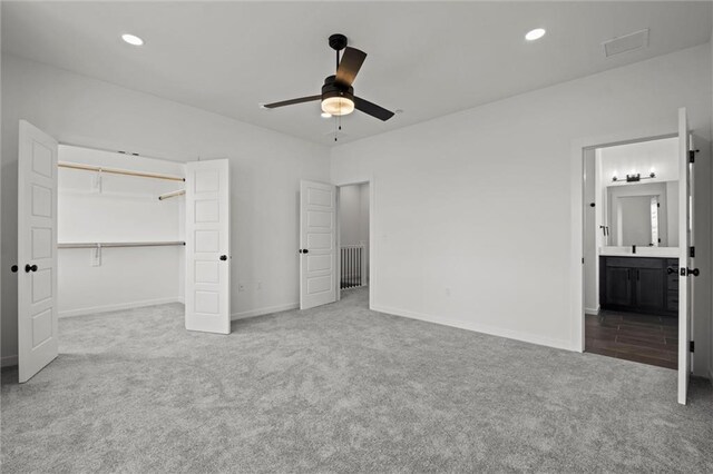 458 SW Brummel Rd, Lees Summit, MO 64081 - unfurnished bedroom featuring carpet floors, baseboards, recessed lighting, ensuite bath, and a closet