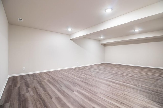 basement featuring wood-type flooring