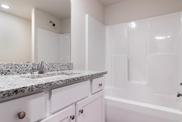 bathroom with vanity and shower / tub combination