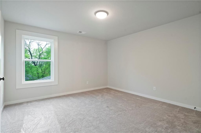 unfurnished room featuring carpet flooring