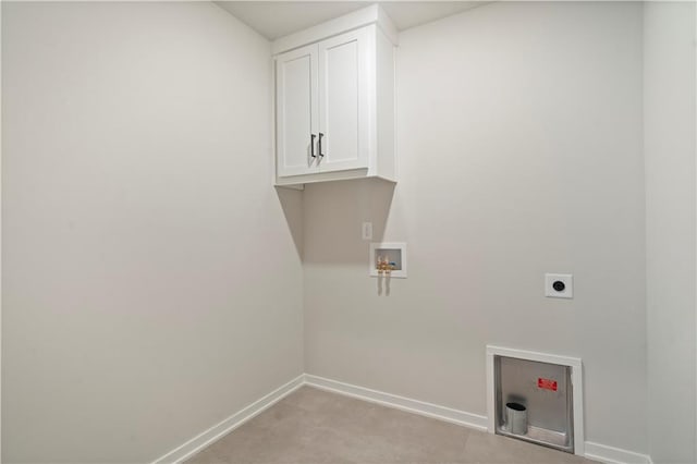 clothes washing area featuring electric dryer hookup, cabinets, hookup for a washing machine, and carpet floors