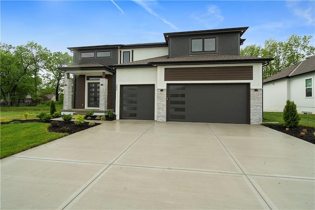 prairie-style home featuring a garage