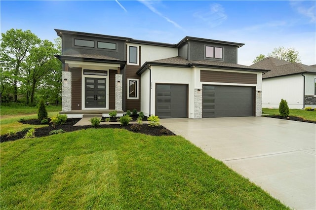 prairie-style house with a garage and a front lawn