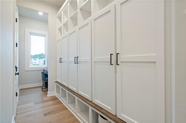 mudroom with light hardwood / wood-style flooring