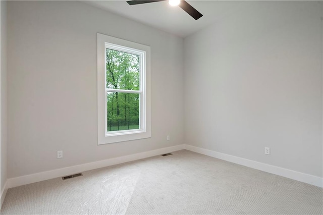 carpeted empty room with ceiling fan