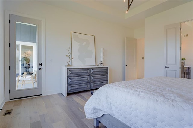 bedroom with light hardwood / wood-style flooring