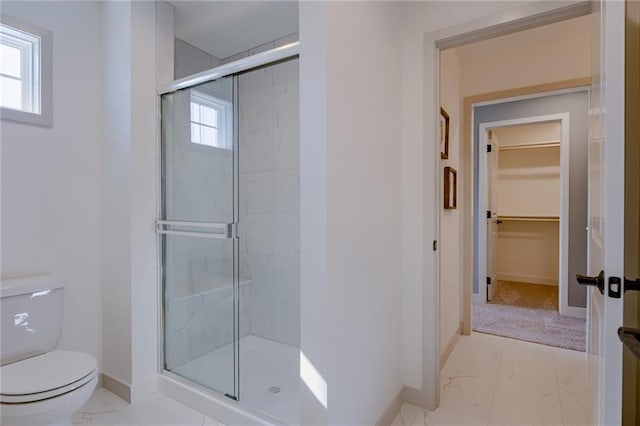 bathroom featuring tile floors, plenty of natural light, and toilet