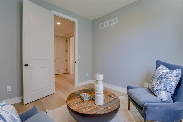 sitting room featuring light hardwood / wood-style floors