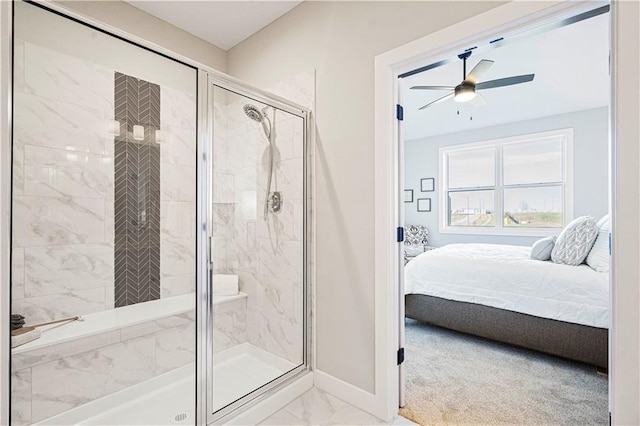 bathroom featuring ceiling fan and a shower with door