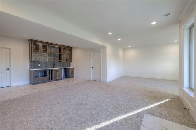 unfurnished living room with light carpet