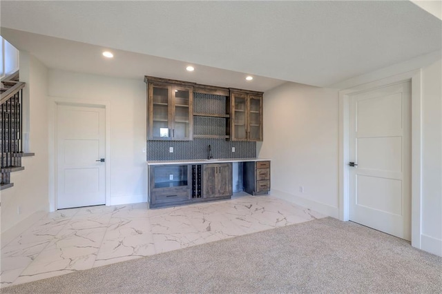 bar featuring tasteful backsplash