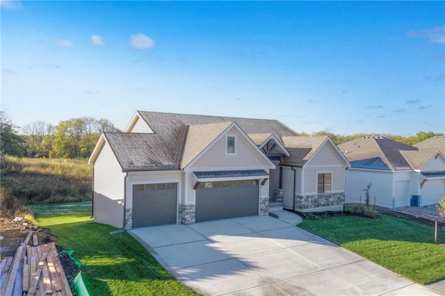 view of front of house with a front lawn and a garage