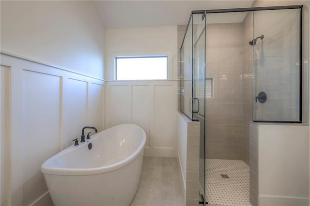 bathroom featuring tile patterned floors and shower with separate bathtub