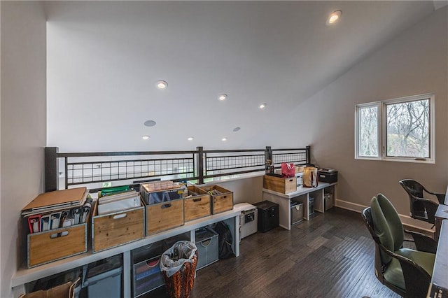 home office featuring dark hardwood / wood-style flooring and lofted ceiling