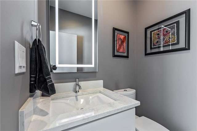 bathroom with vanity and toilet