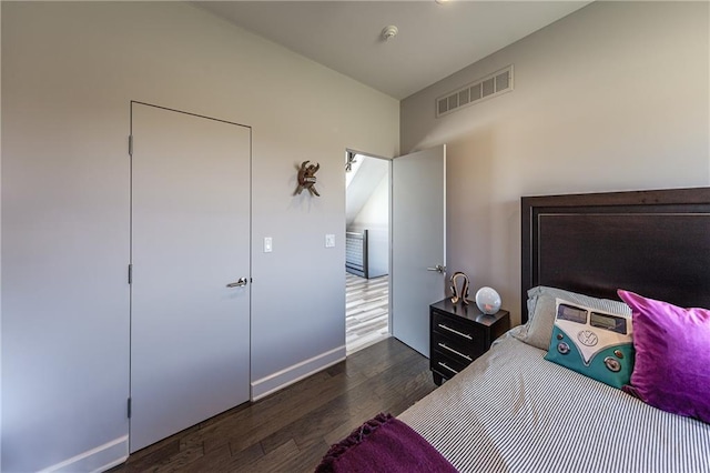 bedroom featuring dark wood-type flooring