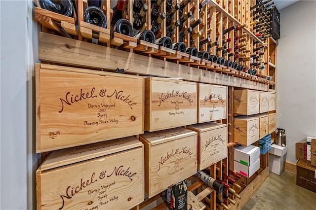 wine room featuring concrete flooring