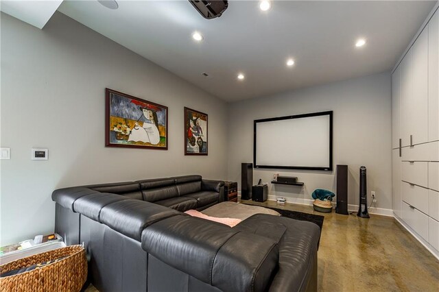 cinema room with concrete floors