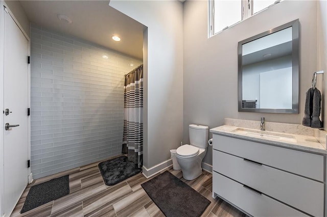 bathroom featuring toilet and vanity