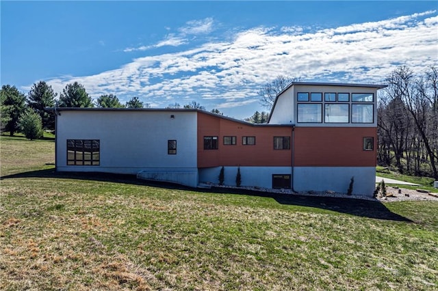 view of home's exterior with a lawn