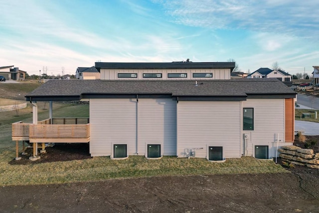 view of side of home with central air condition unit