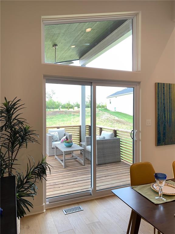 entryway featuring a healthy amount of sunlight and wood-type flooring