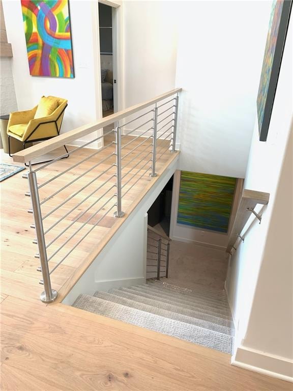 stairway featuring hardwood / wood-style floors