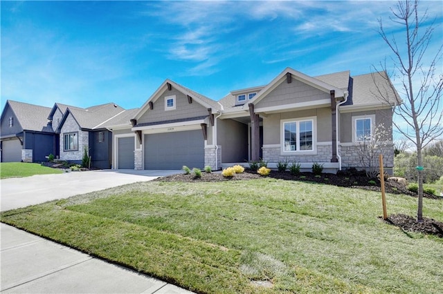 craftsman house with a front yard, an attached garage, stone siding, and driveway