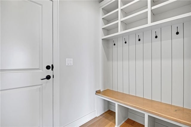 mudroom with light wood-style flooring and baseboards