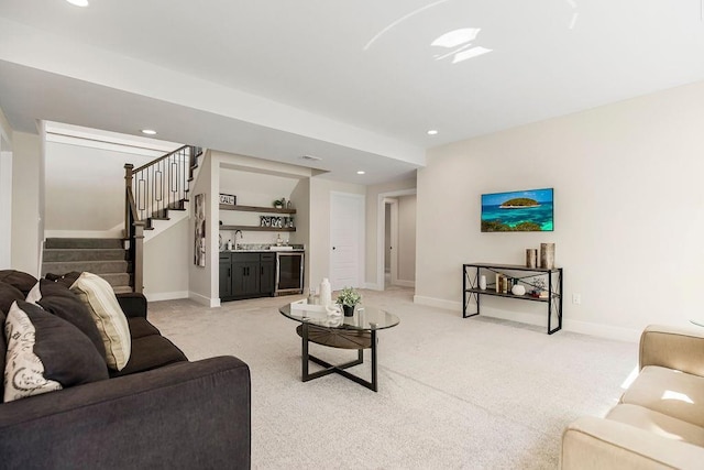 living room with wine cooler, wet bar, and light carpet