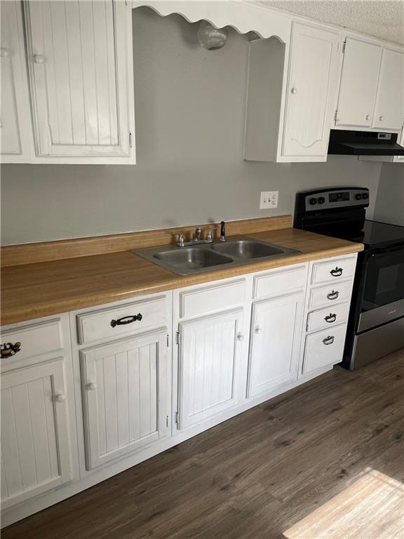 kitchen with white cabinets, stainless steel electric range, sink, and dark hardwood / wood-style flooring