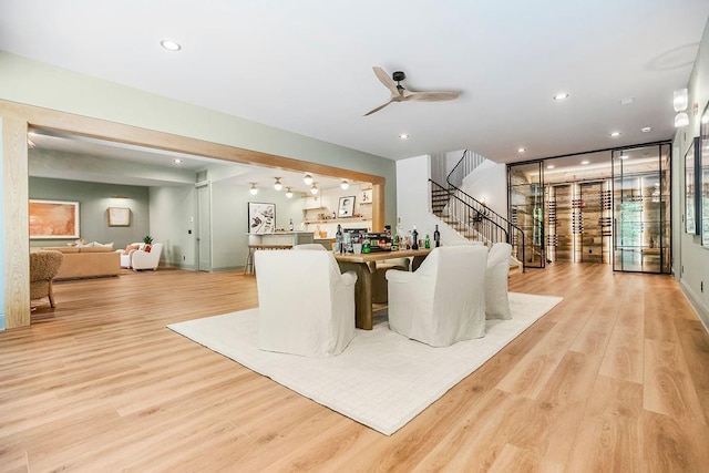 25384 W 107th Ter, Olathe, KS 66061 - dining space featuring light wood-style flooring, stairway, a ceiling fan, and recessed lighting