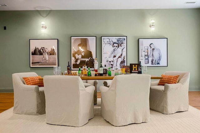 dining area with hardwood / wood-style floors